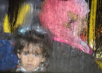 SWNS Pictures of the Year 2015 - One hundred of the most compelling images on the SWNS wire this year as chosen by our picture editors. Refugees from Syria leave Glasgow Airport in five coaches in heavy rain, November 17, 2015, from where they will be dispersed to their new homes within Scotland. See SWNS story SWREFUGEE: The first charter flight carrying Syrian refugees arrived in the UK yesterday (Tues) as part of the Government's resettlement scheme. Around 100 people were transported by plane from refugee camps in the Middle East, travelling from Beirut in Lebanon to Glasgow Airport. Many have been described as vulnerable and some had stayed in camps for up to four years. Landing in Glasgow at 3.30pm yesterday afternoon, the first arrivals were expected to be resettled by local authorities across the country, including Glasgow and Edinburgh.