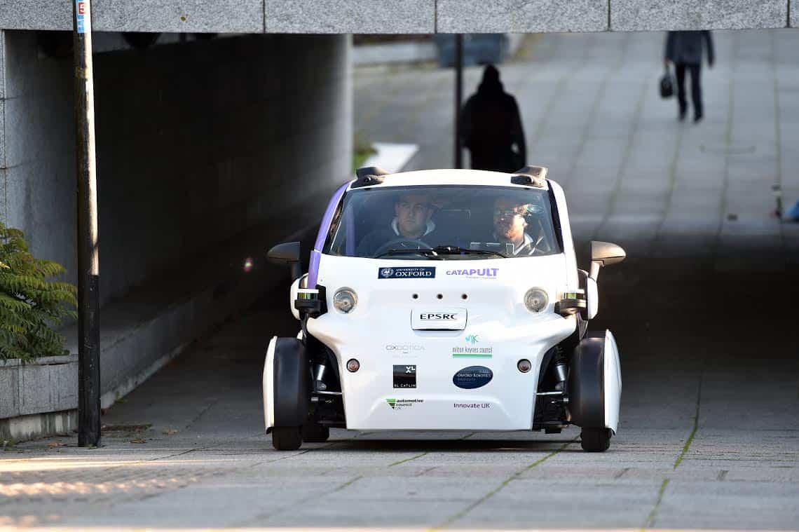 The first UK trials of a driverless car is seen on the streets of Milton Keynes. See MASONS story MNCAR: The UK's first driverless car hit the streets for the first time yesterday (tues) for trial tests which were deemed a success. The self-driving vehicles were being trialed carrying passengers while the cars operated entirely without human control. The two-seater pods, which are similar to Smart cars in appearance, are versions of the Lutz Pathfinder, the UK's first driverless car. They operate at speeds of up to 15mph without human assistance and follow routes from virtual maps.