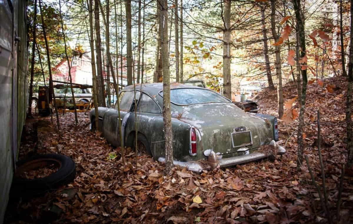 A classic Aston Martin is expected to sell for more than £350,000 despite being a wreck which has languished in a wood for more than 40 YEARS. See SWNS story SWASTON; The Aston Martin DB4 was the first production car capable of doing 0-100-0mph in less than 30 seconds when it was launched in 1958. It was built to compete with sports cars from Ferrari and Maserati - but this particular model hasn’t moved in almost half-a-century. The car was manufactured in the UK in 1960 and then shipped across to the USA, where it was registered the following year.  At some stage in the early 1970s it was parked outdoors at the owner's home in New Hampshire, Massachusetts, USA, where it remained until recently. Over the past five decades, the car’s condition has deteriorated after it was surrounded by trees and buried halfway up to its now rusty wheels by leaves.