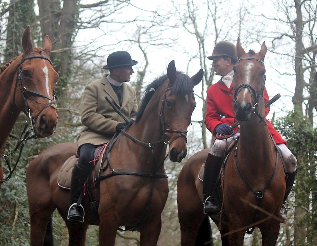 Rev Neil Patterson in a beige hunting jacket (left) with Major Patrick Darling, former High Sheriff of Herefordshire on February 20, 2016 when the Three Counties Hunt Saboteurs claim he was at a meet of South Herefordshire Hunt in Brockhampton. See SWNS story SWHUNT; A campaign has been launched calling for a vicar to be sacked after footage emerged which appears to show him at a hunt meet - at his parish CHURCH. The Rev Neil Patterson, 36, has been accused of lacking Christian values after photos surfaced of him on a horse with the notorious South Herefordshire Hunt. The Hunt is being investigated for animal cruelty over footage was released in June which appears to show live fox cubs being thrown to a pack of hounds to savage. Five people have been arrested so far this summer as part of the inquiry.