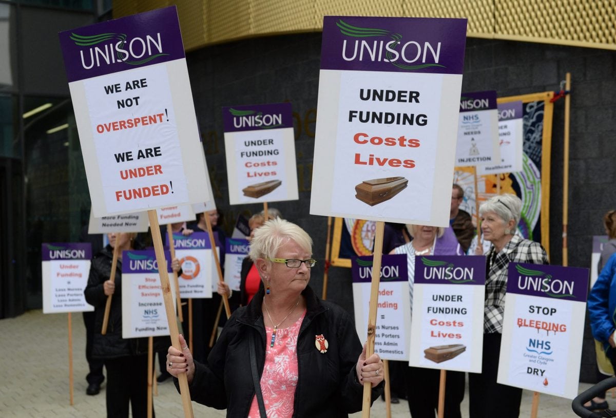 Members of Unison and other NHS campaigners protest outside The Queen Elizabeth Hospital ahead of a meeting of NHS Greater Glasgow and Clyde annual board meeting. August 4, 2016. The protesters are blaming the authority for a number of cuts to services.