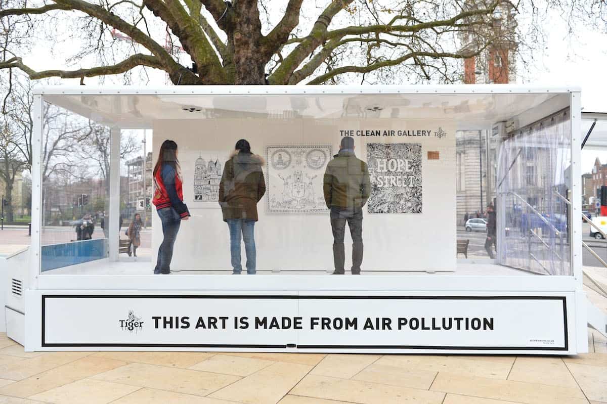 EDITORIAL USE ONLY
Visitors look at artworks inside the Tiger Beer ‘Clean Air Gallery’ in Brixton, the works were created using Air-Ink™, the first ink to be made from captured air pollution before it enters the atmosphere. London. PRESS ASSOCIATION Photo. Picture date: Monday March 27, 2017. Photo credit should read: Matt Crossick/PA Wire
