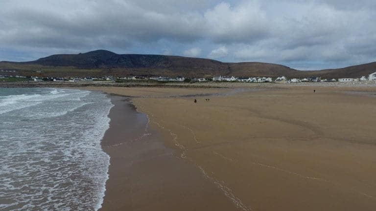 Villagers are delighted after this entire beach that was washed away 33 years ago has re-appeared - virtually overnight thanks to a freak tide. See SWNS story SWBEACH; The stunning beach near the Irish village of Dooagh on Achill Island vanished in Spring storms of 1984 after waves washed away all the sand. With nothing more than rock pools left behind, almost all the villages' hotels, guesthouses and cafes shut down. But miraculously thanks to a freak tide, hundreds of thousands of tons of sand were dumped on the beach over ten days in April, re-creating a stunning 300m long beach.