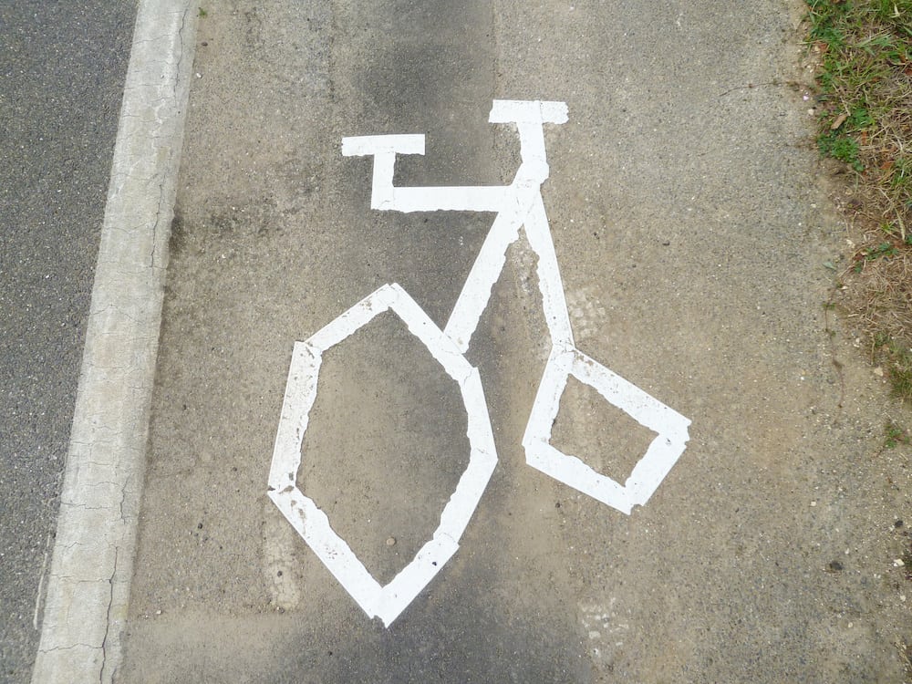 Bungling council workers have been slammed after this terrible image of a bike "looking more like a penny-farthing" was painted on a cycle lane.  See NTI story NTICYCLE.  Residents living in Sleaford, Lincs., were left scratching their heads after the wonky  markings appeared on the pavement over the weekend.  Locals said the cycle path looked like the "scrawlings of a child" while others compared it to a 19th Century penny-farthing bicycle.  Red-faced bosses at Lincolnshire County Council are now having to replace the image on London Road with the correct template.  Retired HR manager Paula Brown, 61, who lives nearby, said she found the gaffe "hilarious" but was angry it would probably cost taxpayers' cash to rectify.