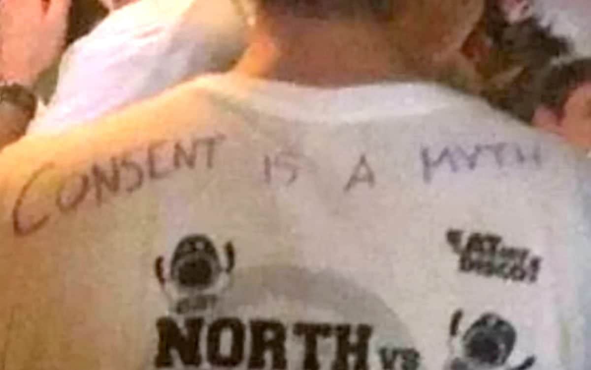 A student wearing the consent is a myth top. See Ross Parry story RPYCONSENT; Horrified drinkers from Sheffield, South Yorks., hit out at a group of students on a bar crawl who wrote consent is a myth on their t-shirts. According to people who were there, other t-shirts had "rape is not a crime" and "she CAN be asking for it" written on them. The group wearing the t-shirts were on the freshers bar crawl, an event for both University of Sheffield and Sheffield Hallam students. They were at Tiger Works when a Hallam second year student took the photo below, and allegedly asked a bouncer for the group to be escorted out the bar.