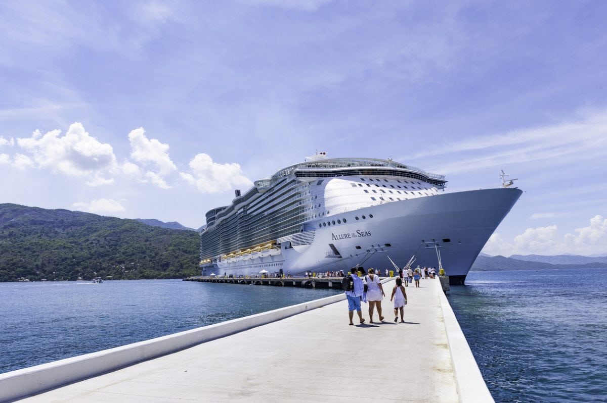 Labadee, Haiti - October 9, 2012: Passengers disembark the Royal Caribbean Cruise ship the Allure of the Seas for a day of beach activities. With a passenger capacity of over 8 thousand, the Allure of the Seas is the largest cruise ship in the world to date.