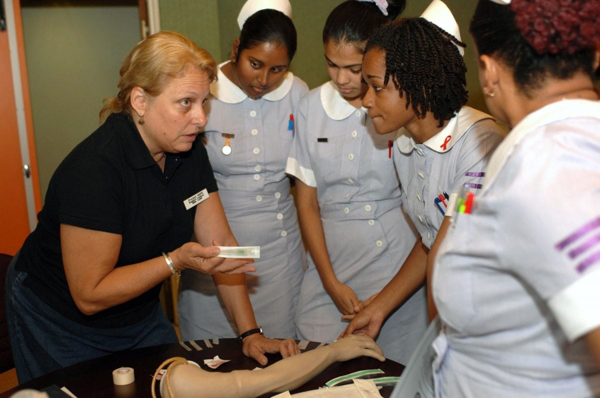 070918-N-7088A-100
CHAMPS FLEURS, Trinidad and Tobago (Sept. 18, 2007) - Genie Lindsey, a registered nurse with Project Hope attached to Military Sealift Command hospital ship USNS Comfort (T-AH 20), explains the correct procedures for administering an intravenous tube to nursing students at the Eric Williams Medical Science Complex. Comfort is on a four-month humanitarian deployment to Latin America and the Caribbean providing medical treatment to patients in a dozen countries. U.S. Navy photo by Mass Communication Specialist 2nd Class Elizabeth R. Allen (RELEASED)