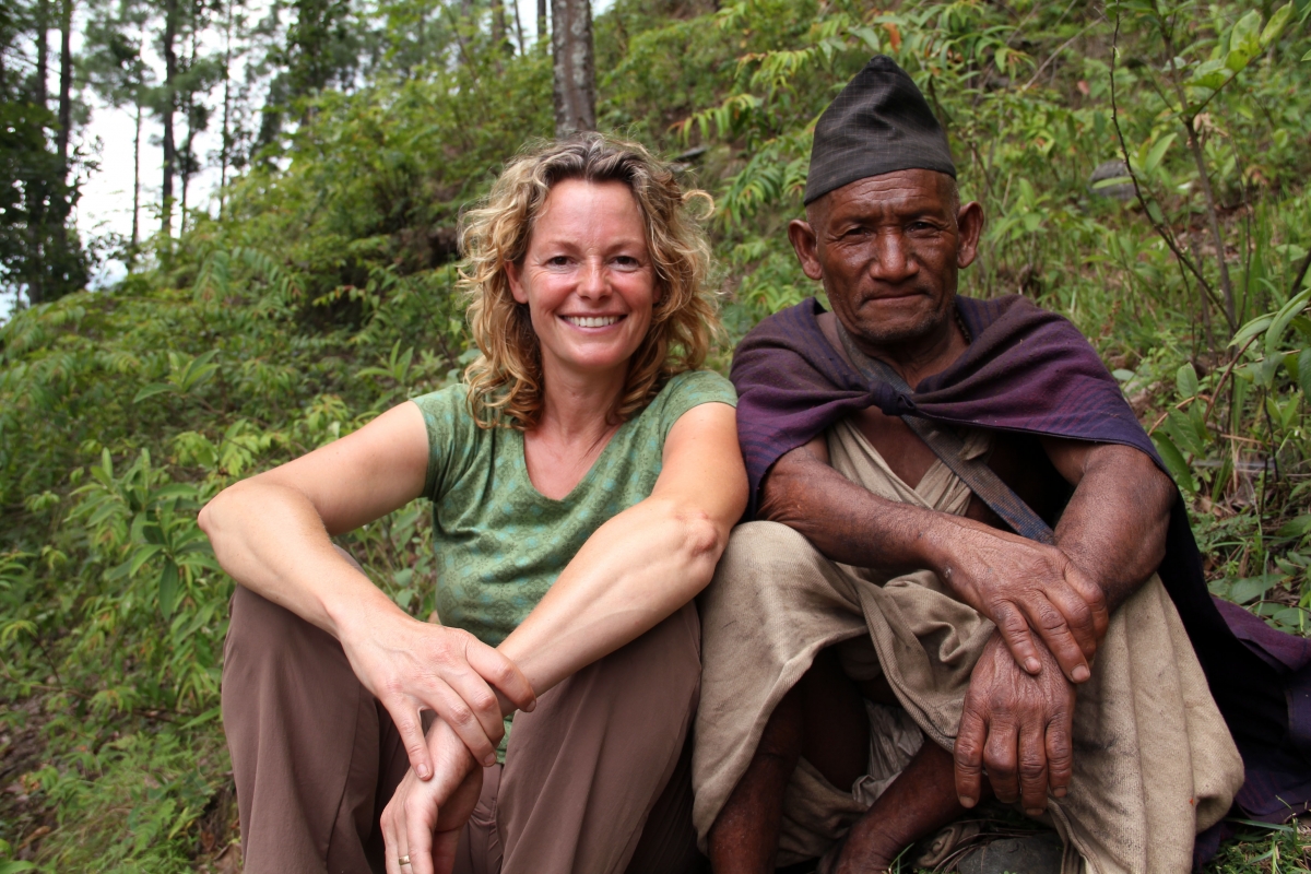 Programme Name: Kate Humble: Living with Nomads - TX: 05/06/2015 - Episode: Kate Humble: Living with Nomads - Nepal (No. 1) - Picture Shows: Presenter Kate Humble sat with Mein Bahadur (Raute elder), Nepal
- (C) Indus Films - Photographer: Kate Owen