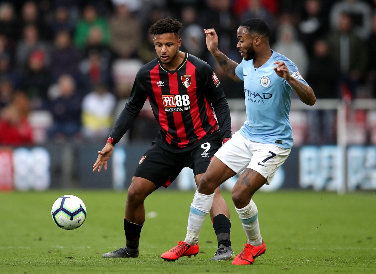 Bournemouth's Lys Mousset (left) and Manchester City's Raheem Sterling battle for the ball during the Premier League match at the Vitality Stadium, Bournemouth.