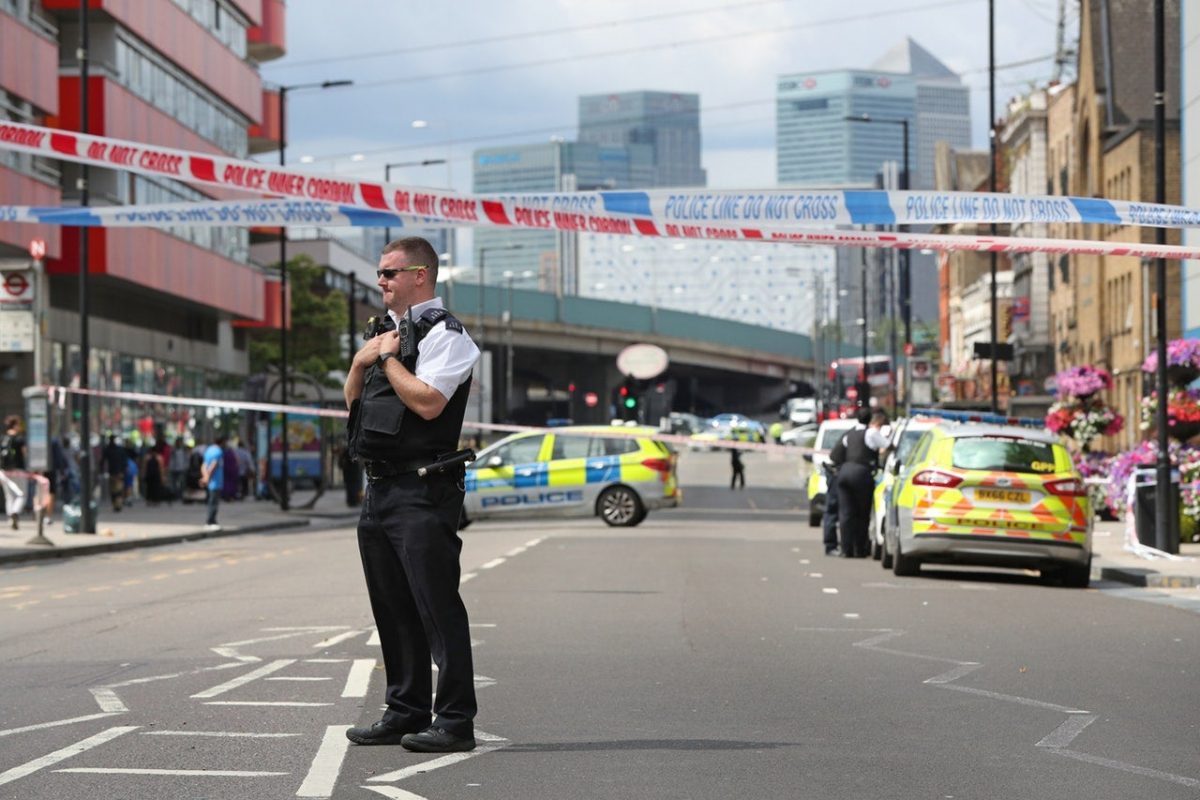 A police officer at the scene of a stabbing in Canning Town, east London (Jonathan Brady/PA)