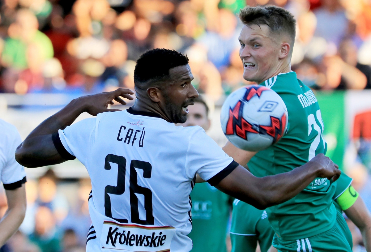 Legia Warszawa's Cafu and Cork's Sean McLoughlin battle for the ball during the UEFA Champions League first qualifying round, first leg match at Turners Cross, Cork.