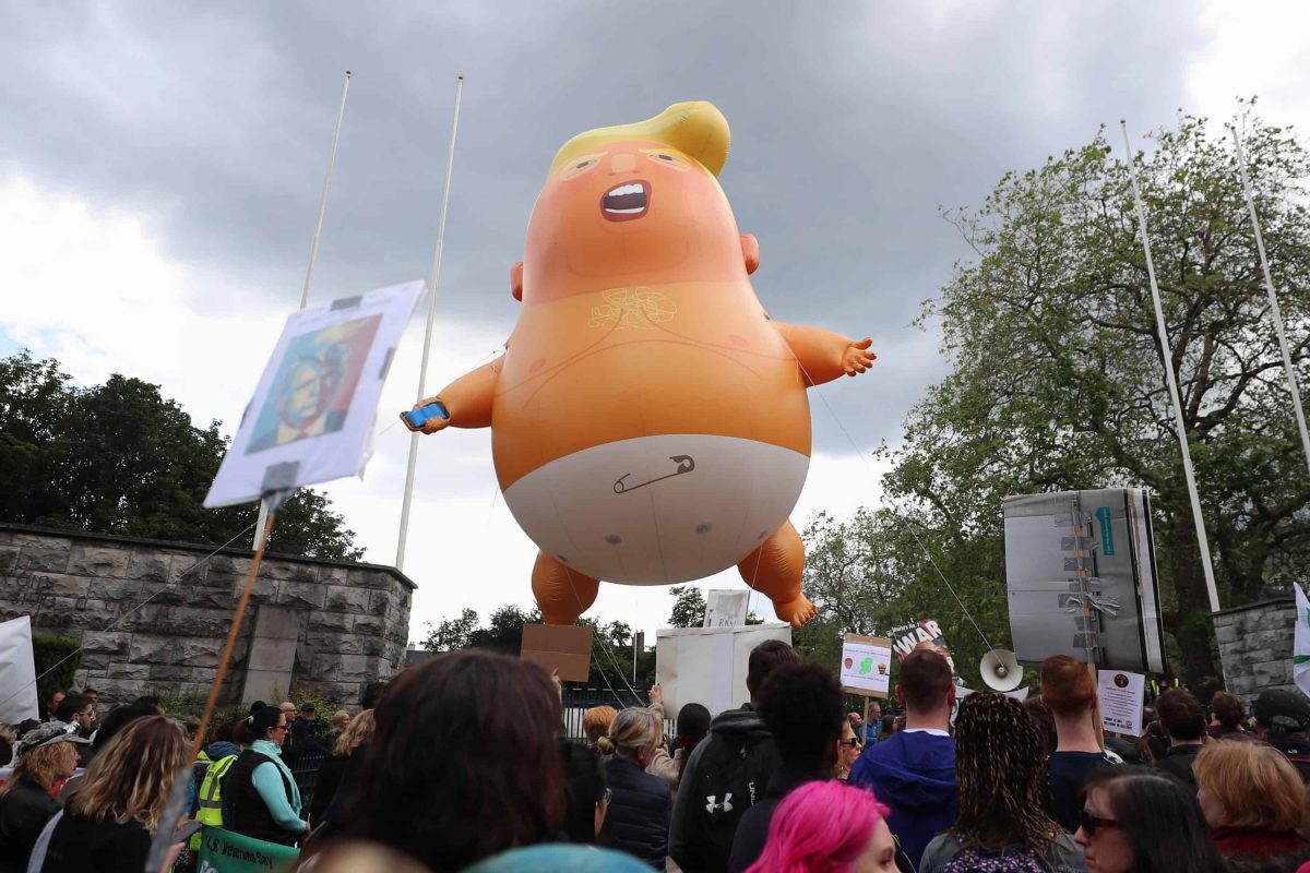 The Trump baby blimp is flown at the Garden of Remembrance in Dublin (Liam McBurney/PA)