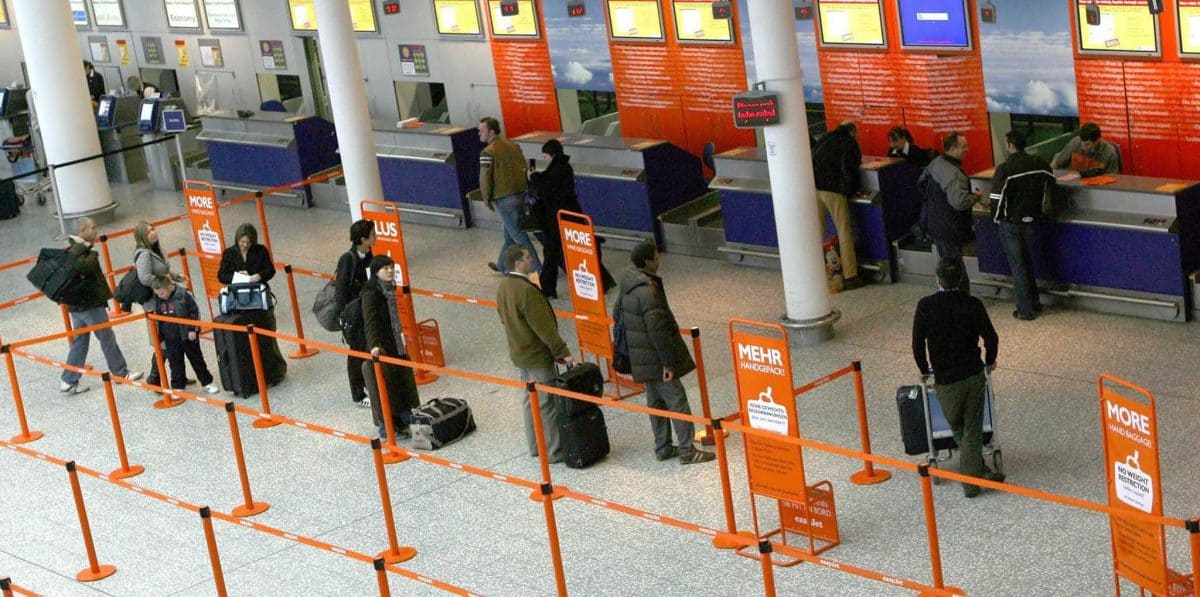 Members of the public wait for flights and transfers at Bristol International Airport as flights are expected to begin arriving again this morning. Credit;PA