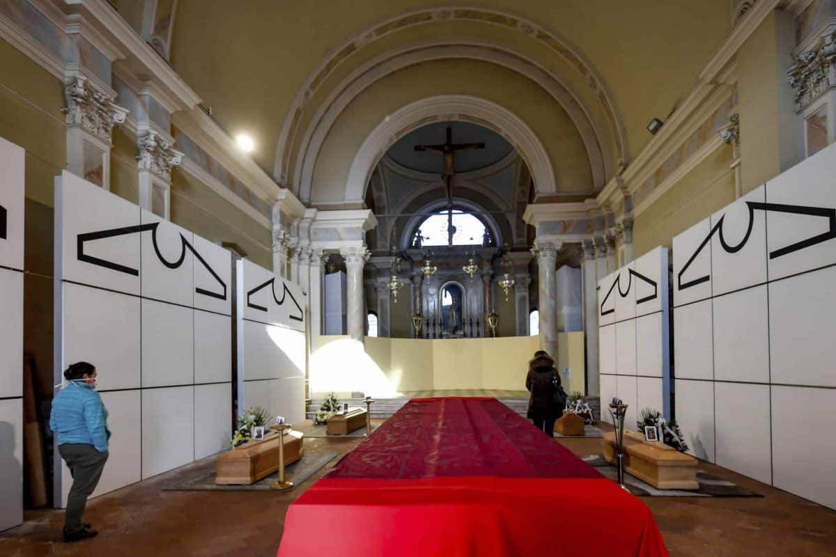Coffins wait to be transported to cemetery, in the church of Zogno, near Bergamo, Northern Italy, Saturday, March 21, 2020. Italy’s tally of coronavirus cases and deaths keeps rising, with new day-to-day highs: 793 dead and 6,557 new cases. For most people, the new coronavirus causes only mild or moderate symptoms. For some it can cause more severe illness. (Claudio Furlan/LaPresse via AP)