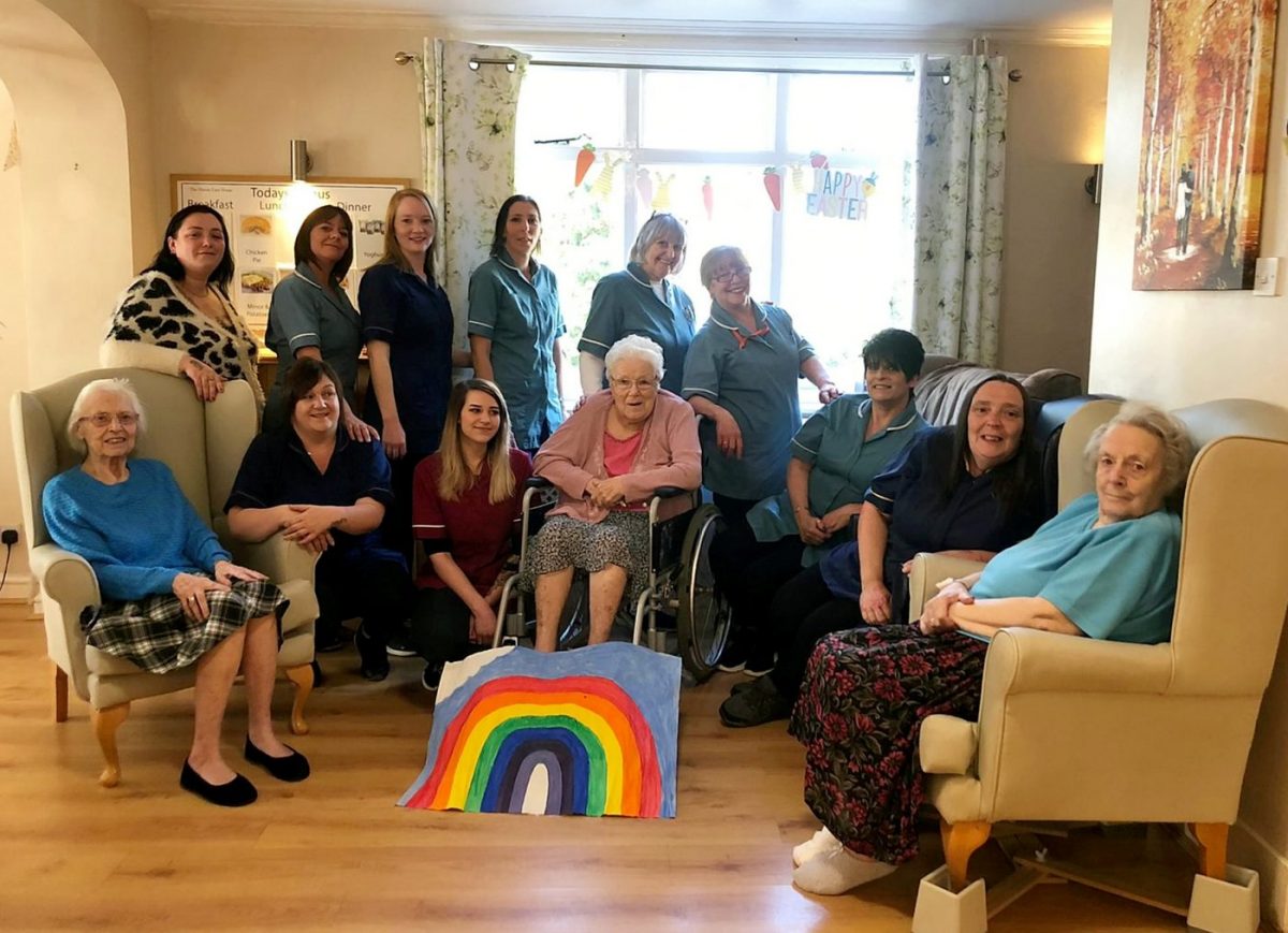 Back row (left to right): Amie Clark, Amanda Taylor, Harriet Mays, Andrea Stockman, Marah Knight, Ornella Phillips.  Front row (left to right): Resident, Sharon Scull, Hannah Richardson, Resident, Helen Lane, Bridie Hancock, Resident.  A group of care workers have chosen to look after their elderly patients during the coronavirus lockdown - instead of living with their own families.  Credit;SWNS