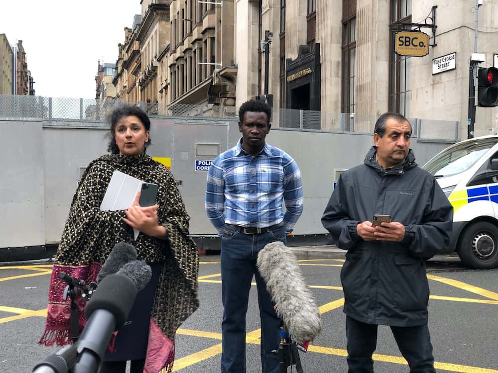 (left to right) Robina Qureshi from the charity Positive Action In Housing, Andrew (no last name given) an asylum seeker and Mohammad Asif speaking to the media in Glasgow about the asylum seeker "accommodation crisis" in Glasgow after an attack in the city last week.Credit;PA