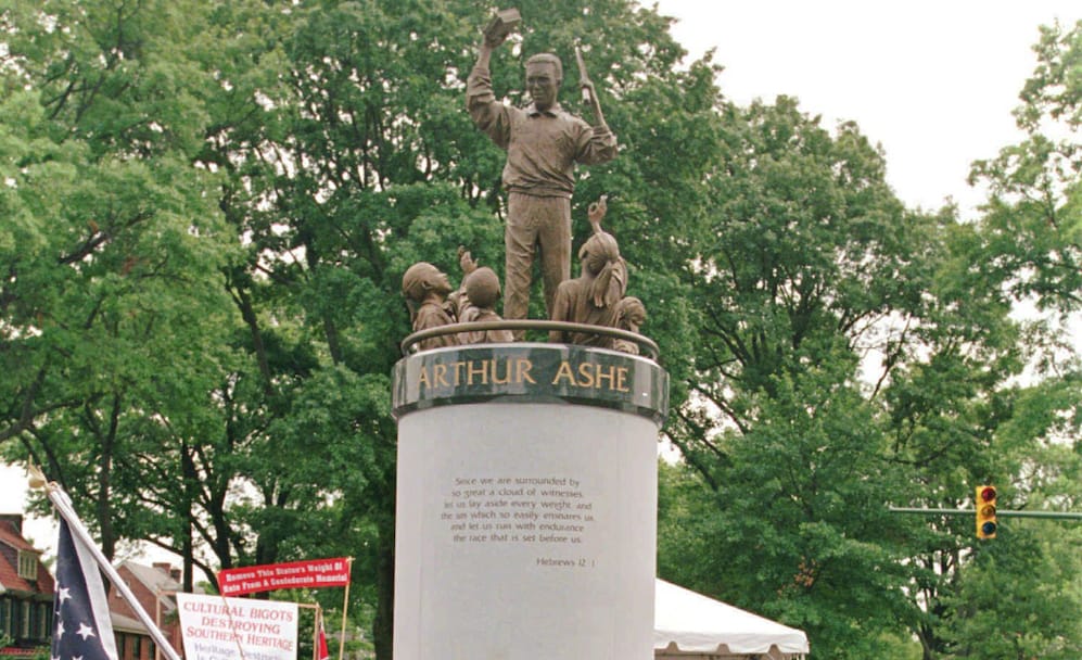 A crowd gathers at the base of the Arthur Ashe Monument after the ceremony dedicating the statue on Monument Avenue in Richmond, Va., Wednesday, July 10, 1996. (AP Photo/Steve Helber)