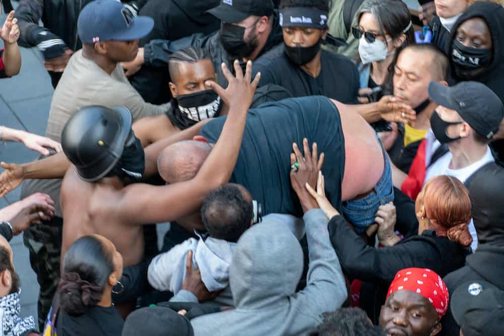 Dramatic photos reveal the melee during the Black Lives Matter protest which led to Patrick Hutchinson and a group of fellow demonstrators saving a white man from the far right racist counter protest after he got into trouble, Waterloo Station, London 13 June 2020. Credit: SWNS