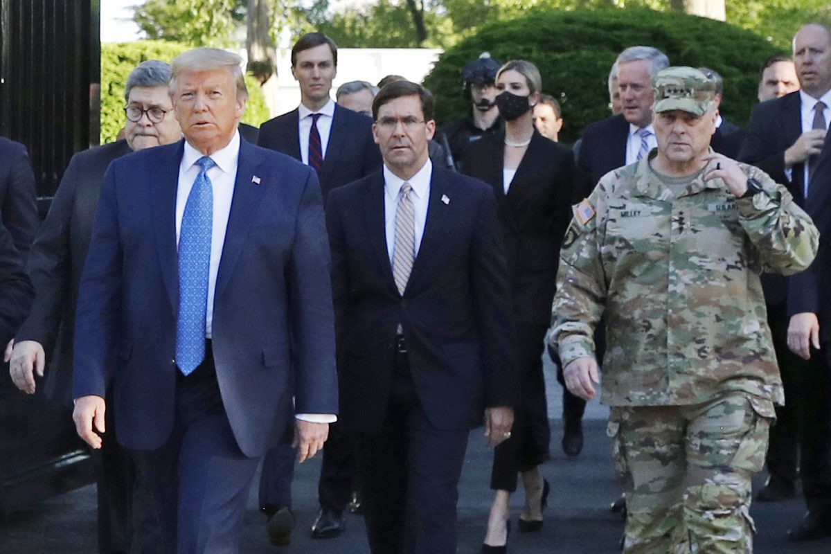 FILE - In this June 1, 2020 file photo, President Donald Trump departs the White House to visit outside St. John's Church, in Washington. Part of the church was set on fire during protests on Sunday night. Walking behind Trump from left are, Attorney General William Barr, Secretary of Defense Mark Esper and Gen. Mark Milley, chairman of the Joint Chiefs of Staff. Milley says his presence “created a perception of the military involved in domestic politics.” He called it “a mistake” that he has learned from. (AP Photo/Patrick Semansky)