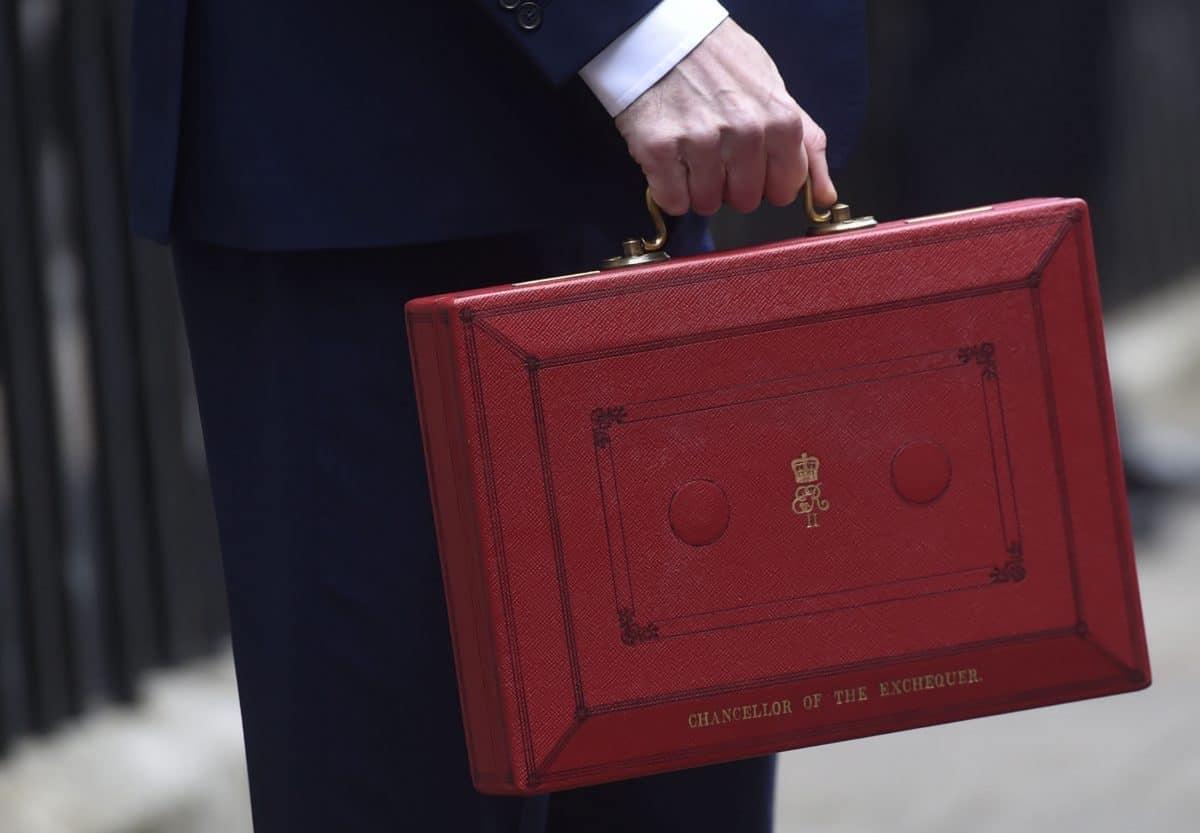Chancellor of the Exchequer George Osborne holding his red Ministerial box outside 11 Downing Street, London, before heading to the House of Commons to deliver his Budget.