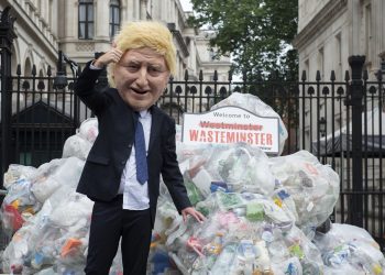 Greenpeace activists dump plastic waste by Downing Street in Westminster, in a protest against plastic waste exports. Photo: PA
