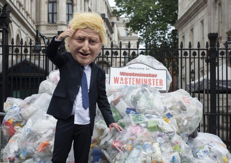 Greenpeace activists dump plastic waste by Downing Street in Westminster, in a protest against plastic waste exports. Photo: PA