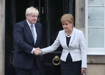 RETRANSMITTED CORRECTING BYLINE Scotland's First Minister Nicola Sturgeon welcomes Prime Minister Boris Johnson outside Bute House in Edinburgh ahead of their meeting.