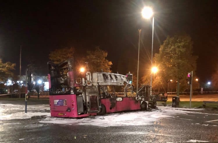 The burnt out double decker bus in Church Road near Rathcoole in Newtownabbey, Co Antrim after it was hijacked and set on fire near a loyalist estate on the outskirts of Belfast. Picture date: Sunday November 7, 2021.