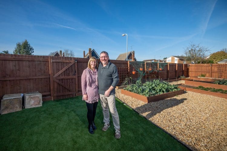 Lee and Kirstie Lawes in thier garden at their home. Credit;SWNS