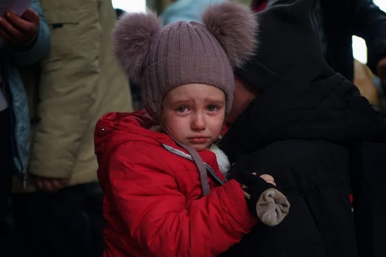A young Ukrainian refugee cries on the shoulder of her mother in the entrance hall at Przemysl Glowny train station in Poland, after arriving by train from Ukraine to flee the Russian invasion. Picture date: Tuesday March 29, 2022.
