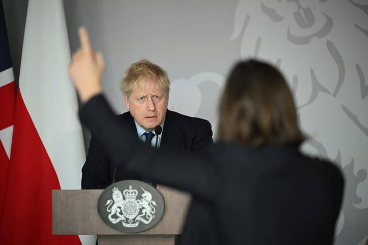 Boris Johnson takes a question from Ukrainian journalist Daria Kaleniuk during a press conference at the British Embassy in Warsaw.