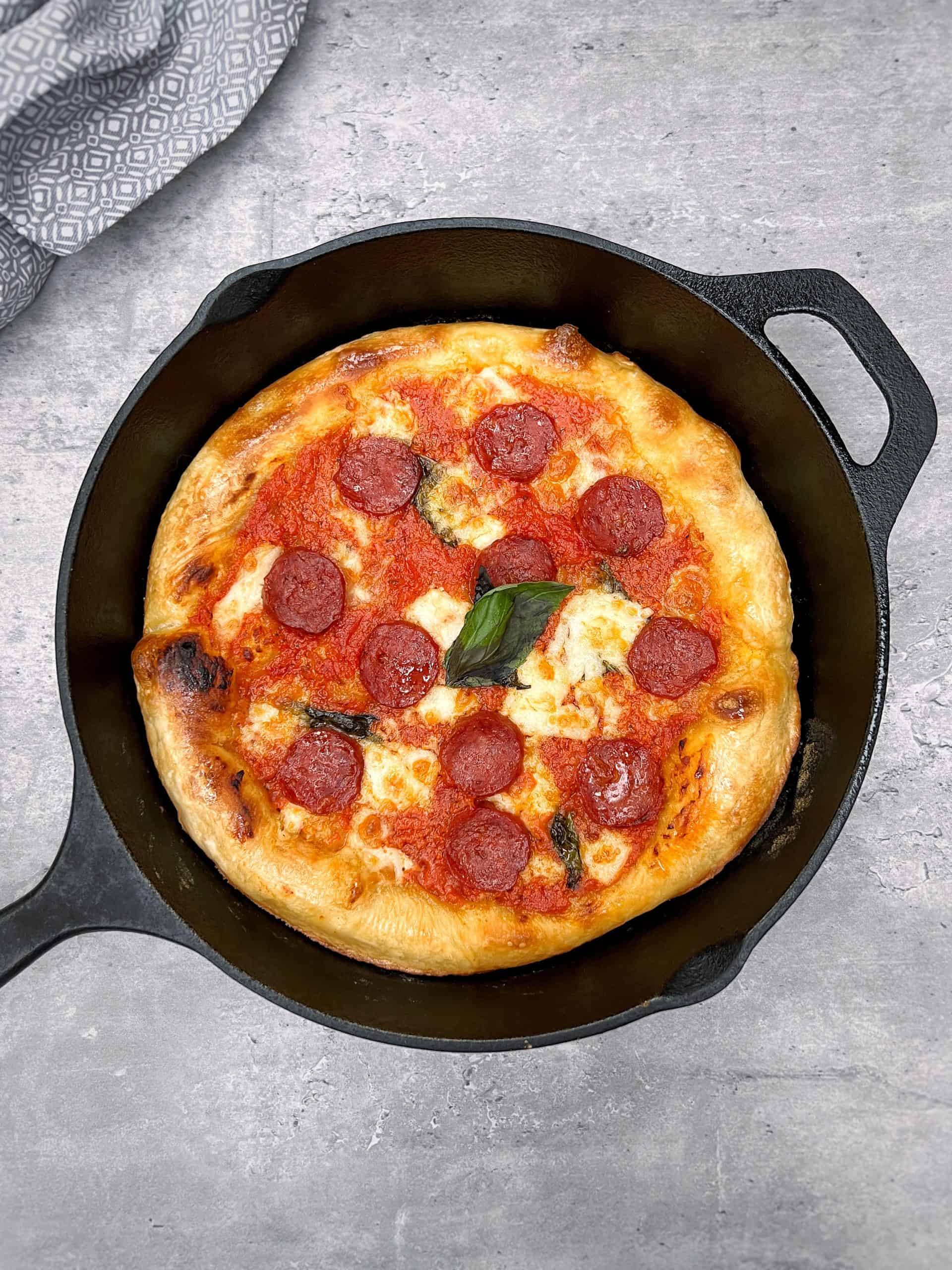 https://cdn.thelondoneconomic.com/wp-content/uploads/2022/05/3181915b-cast-iron-frying-pan-pizza-recipe-jonathan-hatchman-london-economic-scaled.jpg