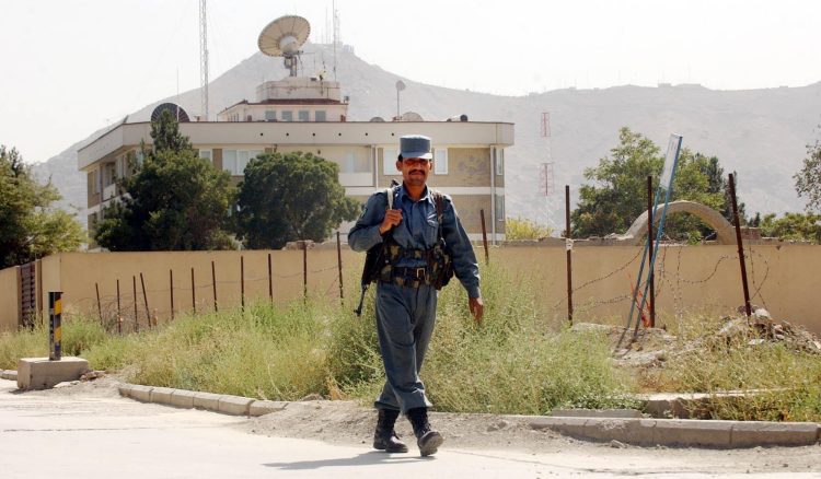 A guard walks in front of the British Embassy in Kabul, Afghanistan. Credit;PA