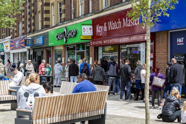 The queue outside the retail financial services provider Cash Shop in Rotherham town cente, Yorkshire. Credit:SWNS